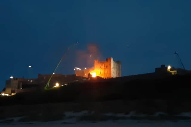 A fire at Bamburgh Castle as filming takes place for a new Indiana Jones movie.