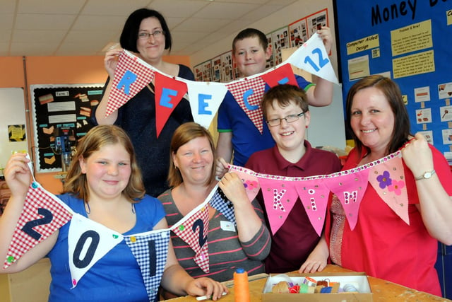 Some of the parents and pupils from Sandhill View school with the bunting they made during a vintage design day 11 years ago.
