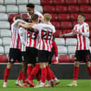 Sunderland players celebrate scoring against Manchester United Under-21s in the Papa John's Trophy.