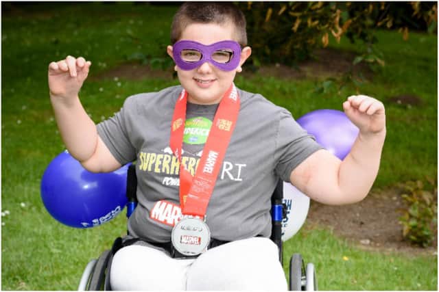 Robbie lost both his legs and fingertips to meningitis but hasn't let it hold him back from taking on the challenge.