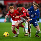 NOTTINGHAM, ENGLAND - JANUARY 01:  Jack Colback and Morgan Gibbs-White of Nottingham Forest is challenged by Conor Gallagher of Chelsea  during the Premier League match between Nottingham Forest and Chelsea FC at City Ground on January 01, 2023 in Nottingham, England. (Photo by Clive Mason/Getty Images)