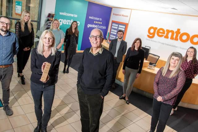 The Gentoo team with development director Joanne Gordon holding their award, with Gentoo chair Keith Loraine, centre.