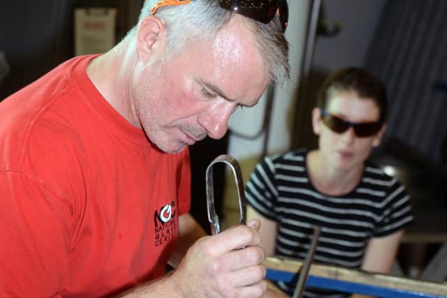 Glassmaker Dave Martin, pictured in 2013, creating a Christmas bauble during a visit from the Echo.