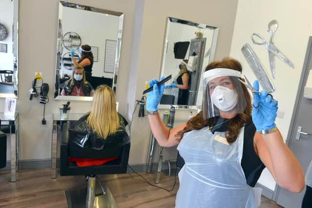 Cloud 9 Hair & Beauty owner Debra Ann Adamson shows how hair appointments will now look as staff and clients wear PPE.