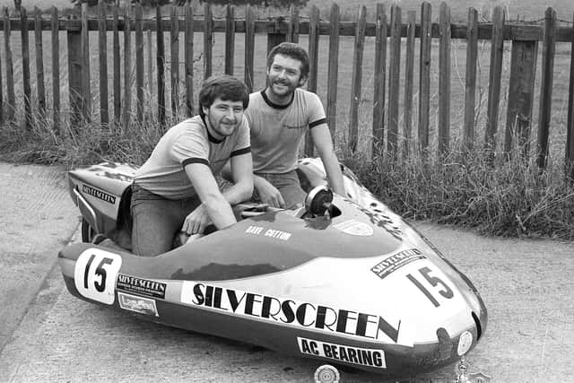 Dave Cotton, left and Roland Reay pictured with their side-car and some of the trophies from their past successes.