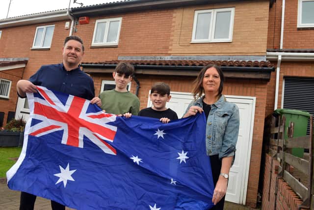 Christine and Paul McDonald and their sons Luke, 16 and Evan, 13 are raffling their house to move to Australia.