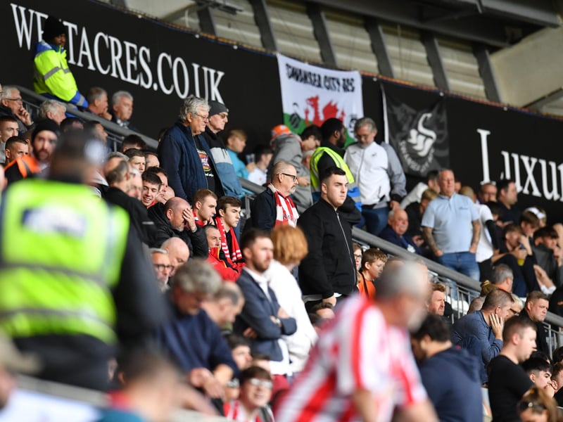Sunderland supporters in action away from home in Wales at the Liberty Stadium against Swansea City in the Championship.