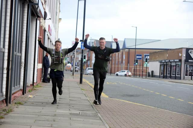 Soldiers John Dixon and Bobby Robson (R) charity run for Veterans in Crisis.