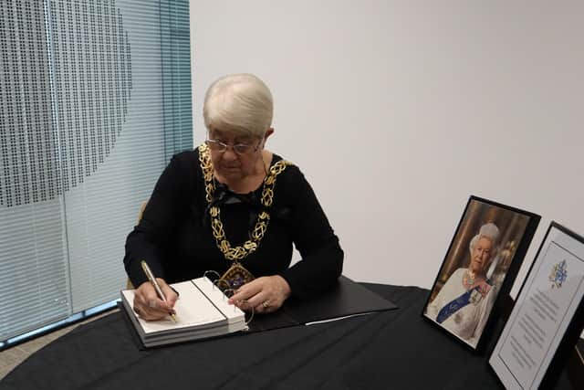 The Mayor of Sunderland, Cllr Alison Smith, signing the Book of Condolence to Her Majesty The Queen at City Hall in Sunderland