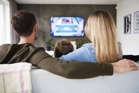 A family enjoys TV together