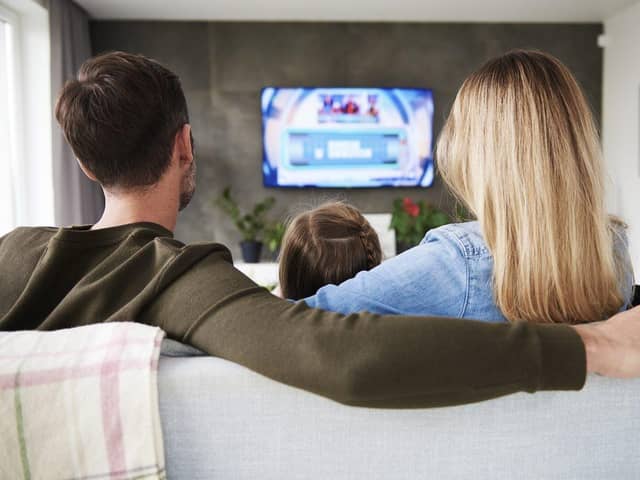 A family enjoys TV together