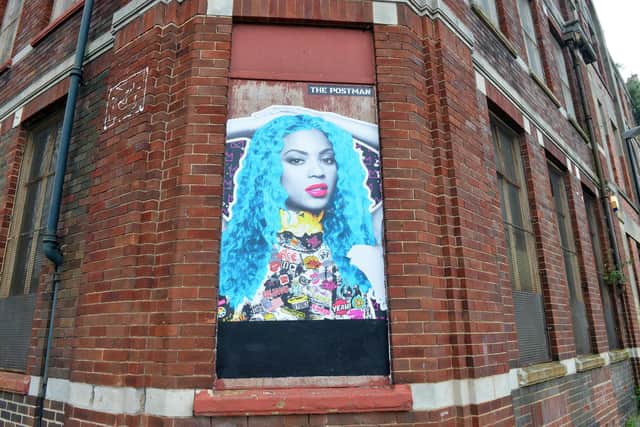 The Postman wall art of Beyoncé on Villiers Street.