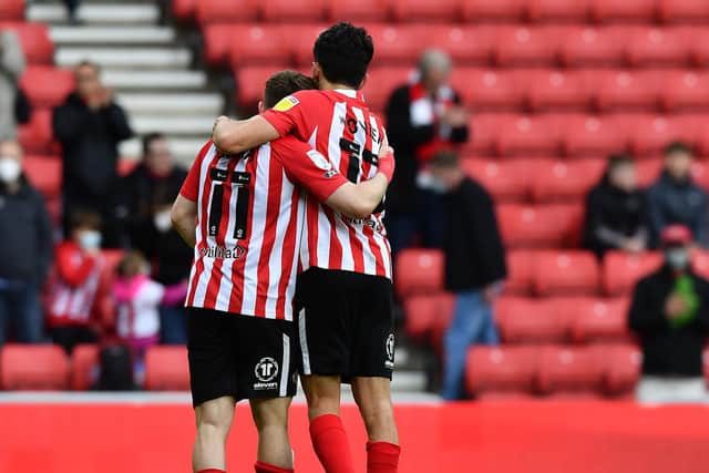 Lynden Gooch and Luke O’Nien at the end of the Lincoln City play-off game.