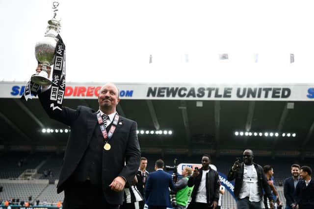 Rafa Benitez with the Championship trophy.