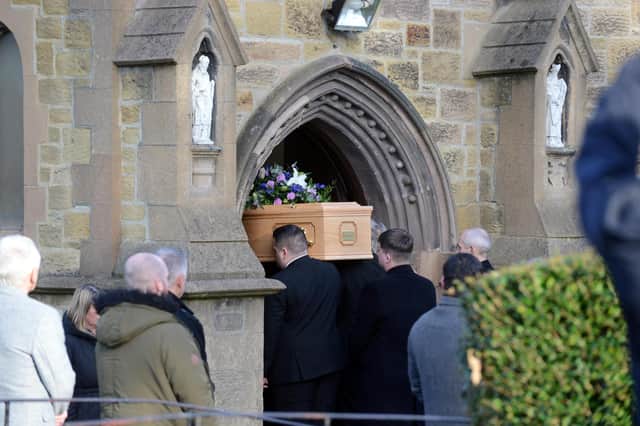 Annie's coffin being carried into the same church in which she was baptised 45 years ago.