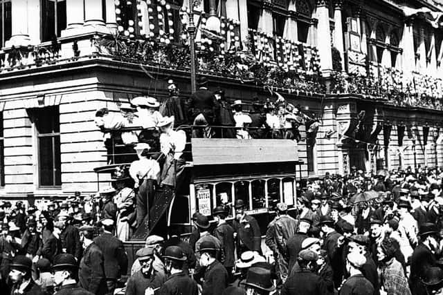 Crowds arriving by tram outside the Town Hall to join in the celebrations.