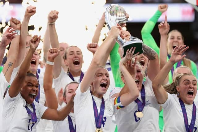 Leah Williamson and Millie Bright of England lift the UEFA Women’s Euro 2022 trophy. Picture: Naomi Baker/Getty Images.