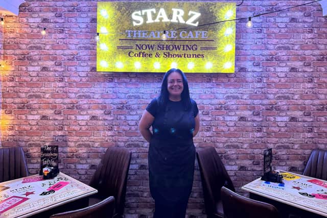 Kym Cuer stands inside her new theatre-themed cafe Starz Theatre Cafe.