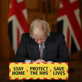 Prime Minister Boris Johnson speaks during a virtual press conference on the Covid-19 pandemic, at Downing Street on January 26, 2021. More than 100,000 people who tested positive for coronavirus have died in Britian since the pandemic took hold last year, official data showed on January 26. (Photo by Justin Tallis - WPA Pool/Getty Images)