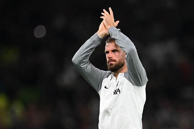 Liverpool's English midfielder Jordan Henderson applauds supporters on the pitch after the English Premier League football match between Manchester United and Liverpool at Old Trafford in Manchester, north west England, on August 22, 2022. (Photo by PAUL ELLIS/AFP via Getty Images)