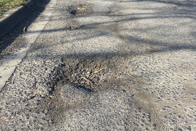 Two large potholes on Vicarage Close. 

Picture by FRANK REID.