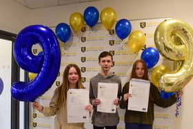 (from left) Imogen, Michael and Milly Laing with their GCSE results