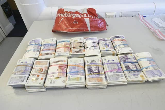 Four men have been arrested and £15,000 of suspected criminal cash seized after a four dawn raids across the North East, including one in Washington.