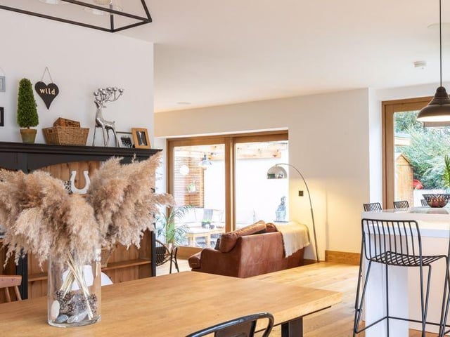 The dining area, with the kitchen area and snug off it.