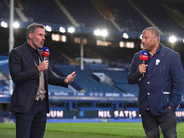 Jamie Carragher speaks with John Barnes for Sky Sports after the Premier League match between Everton FC and Liverpool FC at Goodison Park on June 21, 2020 in Liverpool, England. Football Stadiums around Europe remain empty due to the Coronavirus Pandemic as Government social distancing laws prohibit fans inside venues resulting in all fixtures being played behind closed doors.