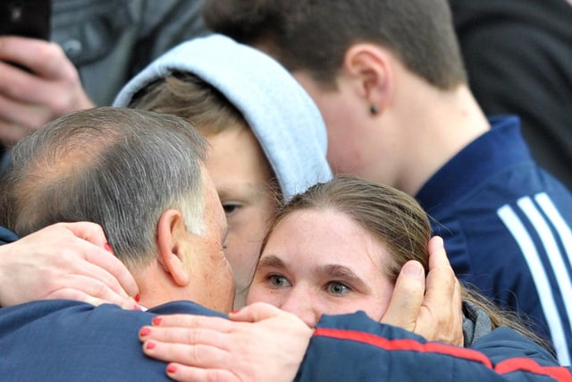 Sunderland manager Dirk Advocaat has a hug from a supporter before their 2-2 draw at the Stadium of Light against West Ham United in 2014.