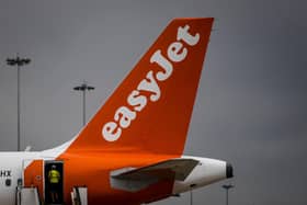 An EasyJet plane is pictured at Faro airport in Algarve, south of Portugal, on June 15, 2021. - British airline EasyJet inaugurated a new base in Faro, in southern Portugal, shortly after the opening of another in Malaga, in southern Spain, betting on the resumption of tourism. (Photo by PATRICIA DE MELO MOREIRA / AFP) (Photo by PATRICIA DE MELO MOREIRA/AFP via Getty Images)