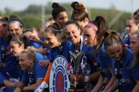 Brianna Westrup of Rangers is seen with the trophy after securing the Scottish Women's League title.