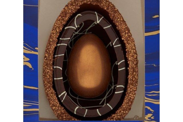 Morrisons has released its own luxury Belgian chocolate egg this year - and it’s got a twist. There are two, thick half egg outside layers protecting the hand-shimmered milk chocolate egg inside. The first is made of smooth chocolate and lustred chocolate vermicelli, while the second is a dark chocolate decorated with white. (Price: £8, Morrisons)