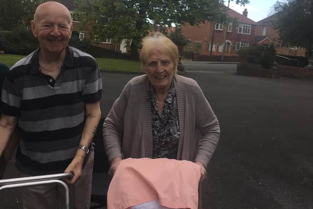 Residents Jimmy and Mary taking part in the walk which has so far raised £785.