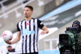 A TV cameraman films during the Premier League match between Newcastle United and Everton.