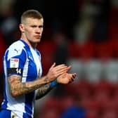 CHELTENHAM, ENGLAND - JANUARY 29:  James McClean of Wigan applauds the fans after the Sky Bet League One match between Cheltenham Town and Wigan Athletic at The Jonny-Rocks Stadium on January 29, 2022 in Cheltenham, England. (Photo by Dan Istitene/Getty Images)