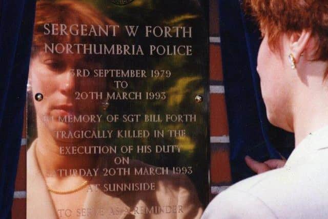 Sgt Bill Forth's widow Gill looks at a memorial to her husband at Northumbria Police headquarters in 1993