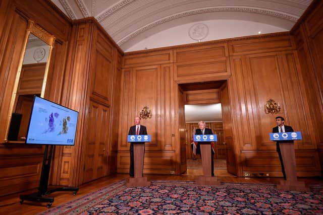 Chief Medical Officer Professor Chris Whitty, Prime Minister Boris Johnson and Chancellor of the Exchequer Rishi Sunak during a media briefing in Downing Street, London, on the new tiered system of coronavirus restrictions. Picture: PA.