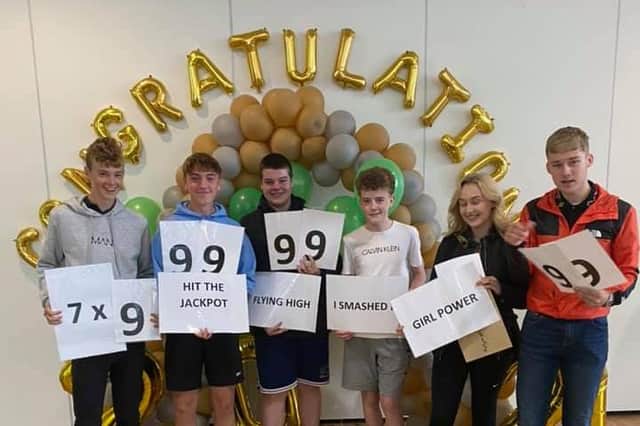 From left to right: St Bede's pupils Karl Bryden, Alfie Kemp, Will Burton, Joshua Booth, Polly Angel Moscrop-Brown and Lewis Fleming with their results on Thursday.