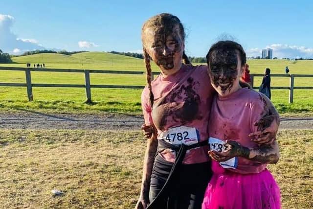Year 9 pupils Lexi Conlon (left) and Nia Watson after taking part in the Pretty Muddy event.
