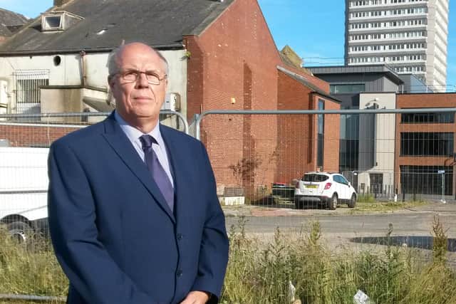 Conservative councillor Michael Dixon has raised questions about the cost of the Shiney Row bungalows.