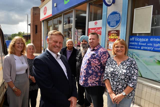 The Southwick Aeroplane Tragedy new blue plaque from the Southwick Green Preservation Society. From left Rita Thompson, Irene Tonkinson, Peter Gibson, John Cuthbertson and Margaret Young with the store owners Mr and Mrs Dhillon.