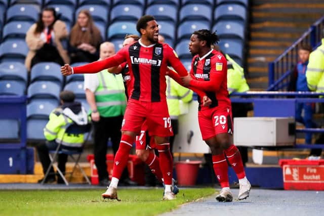 Vadaine Oliver of Gillingham celebrates with teammate Daniel Phillips after scoring their side's first goal during the Sky Bet League One match between Sheffield Wednesday and Gillingham at Hillsborough Stadium on November 13, 2021 in Sheffield, England. (Photo by George Wood/Getty Images)