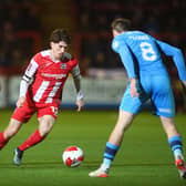 EXETER, ENGLAND - NOVEMBER 30: Josh Key of Exeter City runs with the ball whilst under pressure from Liam Ridehalgh of Bradford City during the Emirates FA Cup First Round Replay match between Exeter City and Bradford City at St James Park on November 30, 2021 in Exeter, England. (Photo by Harry Trump/Getty Images)