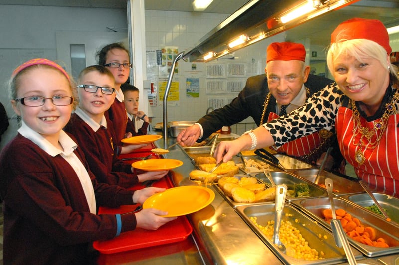 The Mayor and Mayoress take time out to serve the children at Holy Trinity School 7 years ago.