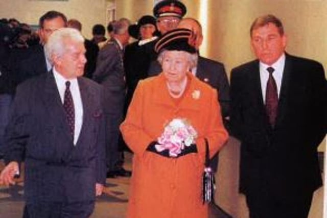 Chairman David Graham, left, and Trust Chief Executive Andrew Gibson accompany the Queen during her tour.