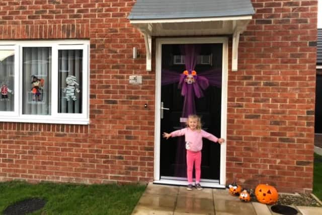 Katie, three, with her pumpkins which went missing. She is still excited for Halloween.