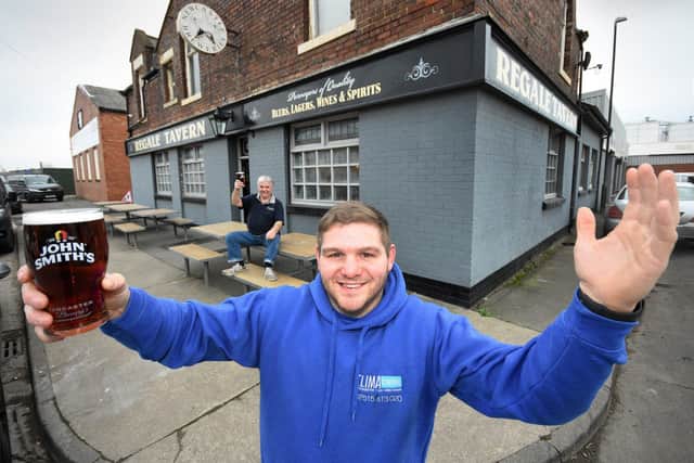 Luke, front, and dad Tom Ratcliffe celebrate the reopening of the historic Regale Tavern after their extensive refurbishment.
