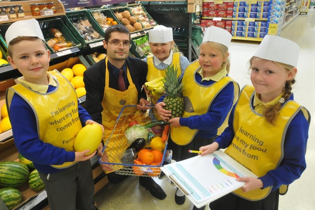 Pupils from Dame Dorothy Primary School visited the Tesco Extra store in Newcastle Road. Pictured with Michael Boyle customer assistant were Year 2 pupils Zac Schonewald, Rebecca Carter, Maddy Scott and Alisha Ord.