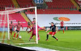 Charlie Wyke scores at Sincil Bank